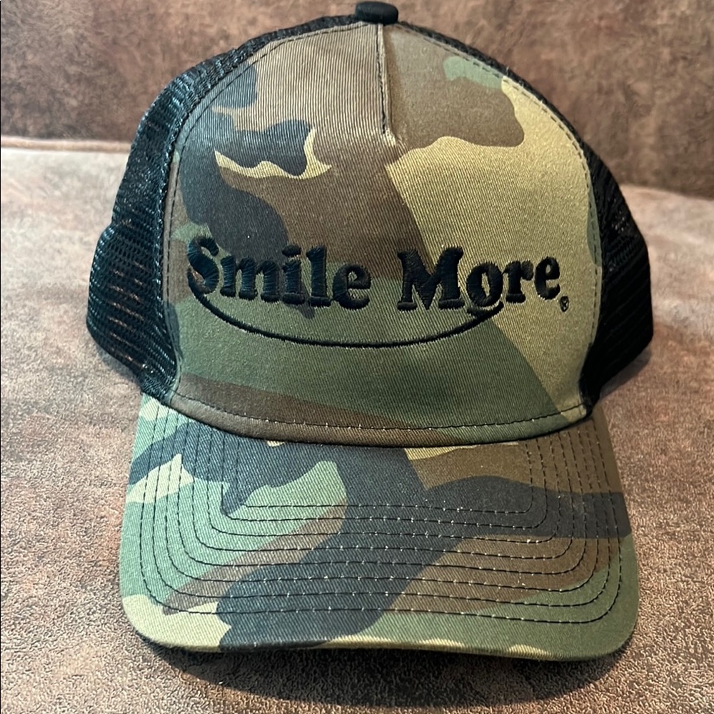 Smile More Camouflage Cap. One size.  Perfect condition.  Smoke free home.